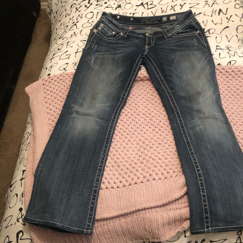 Boot cut distressed jeans